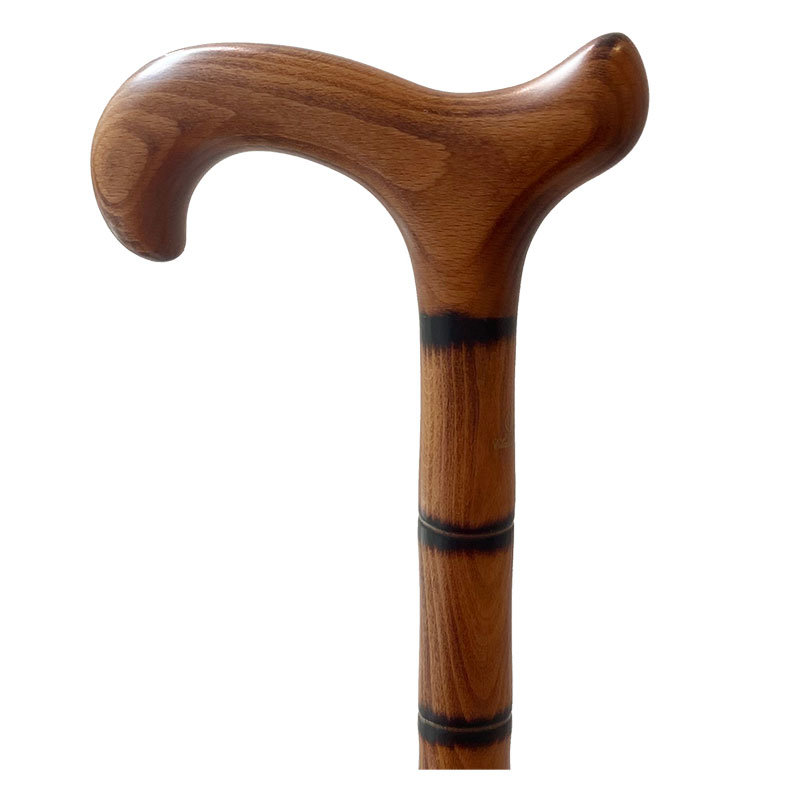 Classic Canes Käpp Beech Derby bild 1 Classic Canes Käpp Beech Derby – trä derbyhandtag bokkäpp i ljust bokträ med svarta dekorringar längs skaftet, bild 1