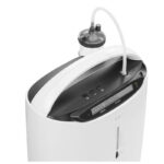 Närbild ovansida med LCD-skärm kontrollknappar och luftfuktarflaska