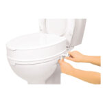 Förhöjare med lock borttaget och synliga gångjärn