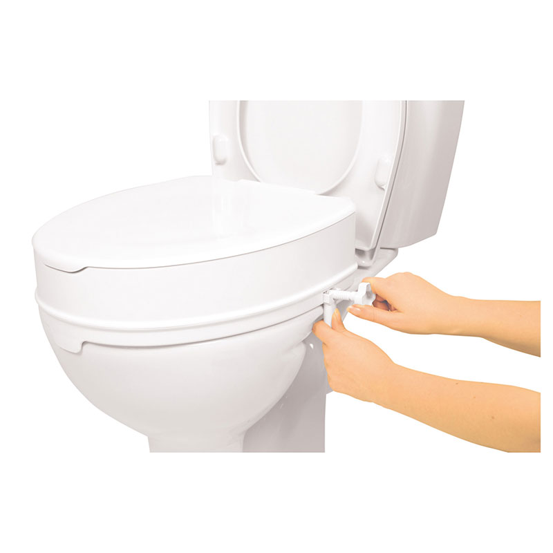 Förhöjare med lock borttaget och synliga gångjärn