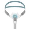 F&P Näskuddemask Brevida framifrån med blågrått huvudband, turkos AirPillow-näskudde och tvättbart filter – CPAP mask sömnapné