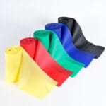 UNIBAND Träningsband 10 cm x 5,5 m – fem ihoprullade elastiska band i gul, röd, grön, blå och svart
