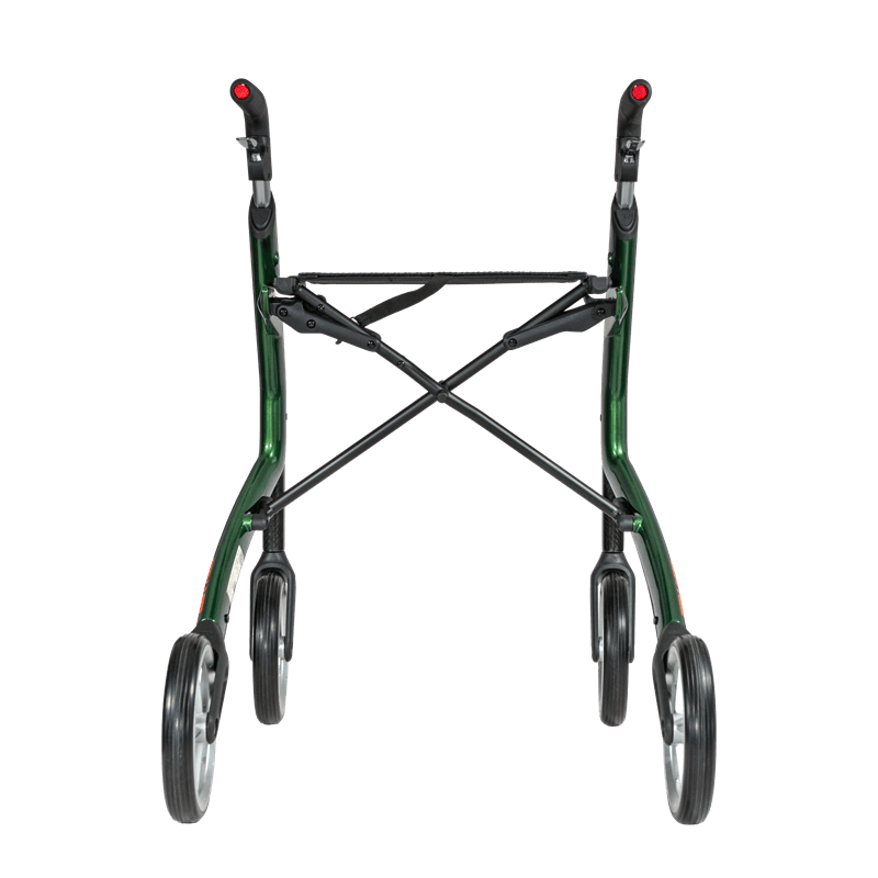 Grön rollator bakifrån med det fällbara kryssbeslaget och sitsremmen