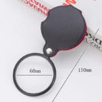 Mått på luppen Luppen utfälld med måtten 60 mm för linsen och 150 mm i total längd